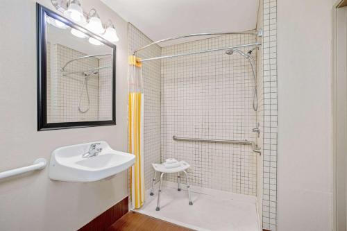 a bathroom with a sink and a shower at La Quinta by Wyndham Corpus Christi Airport in Corpus Christi