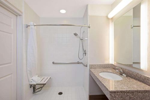 a bathroom with a sink and a shower at La Quinta by Wyndham Modesto Salida in Modesto
