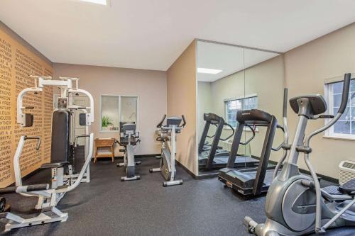a gym with several tread machines and a mirror at La Quinta by Wyndham Modesto Salida in Modesto