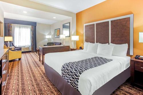 A bed or beds in a room at La Quinta by Wyndham Gonzales TX