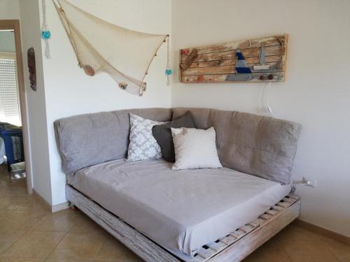 a gray couch in a living room at Le Torrette di Anna - Tropea in Briatico
