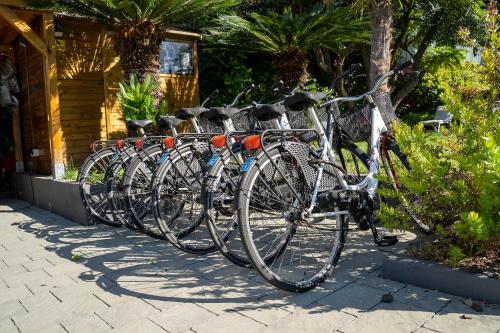 a row of bikes parked next to a building at Blu Hotel in Lavagna