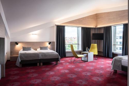 Llit o llits en una habitació de Hotel TAMMEL