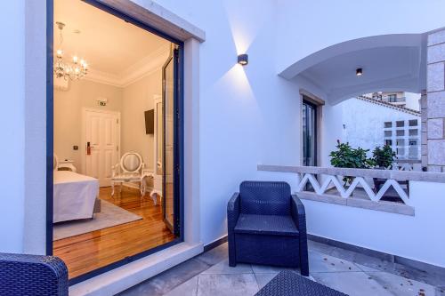 En eller flere senge i et værelse på Villa Mariazinha Charming Hotel