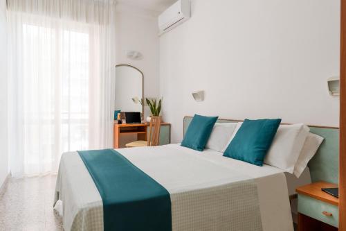 Postel nebo postele na pokoji v ubytování Hotel Très Jolie