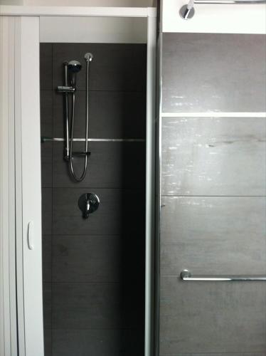 a shower in a bathroom with a glass door at Campo Allegro in Santa Ninfa