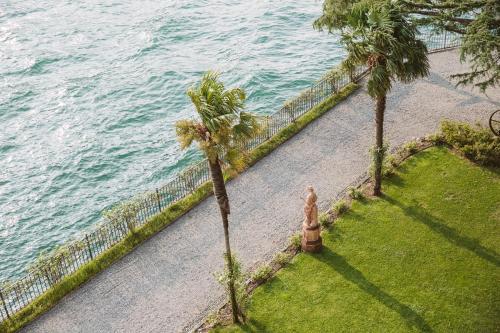 an aerial view of the ocean with a fire hydrant and palm trees at Hotel Villa Flori in Como