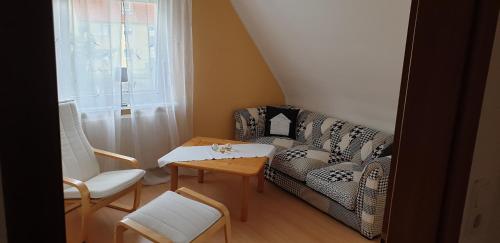 a living room with a couch and chairs and a table at Sebol in Immendingen