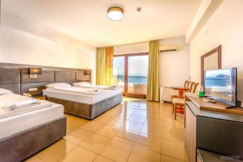 Postel nebo postele na pokoji v ubytování Tino Hotel & SPA