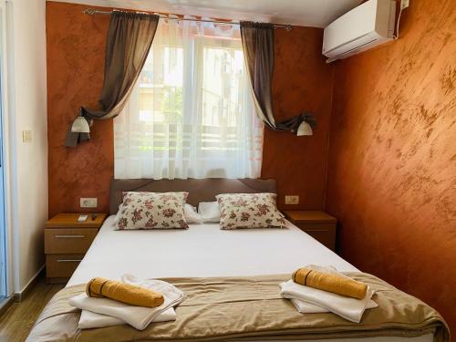 Llit o llits en una habitació de Apart dom Janković