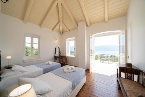 Katil atau katil-katil dalam bilik di Villa Pelagos