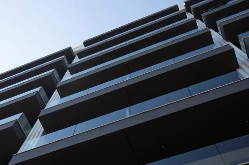 an external view of a black building at Athens Panorama Project in Athens