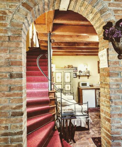 an archway leading up to a staircase in a house at B&B Casa Camilla in Padova