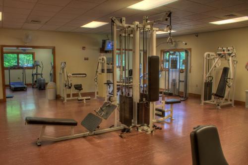 a gym with several tread machines in a room at Foxhunt at Sapphire Valley in Sapphire