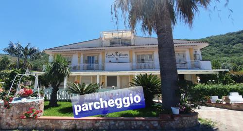 a large house with a sign in front of it at SANTA VENERE Apartments "PARCHEGGIO interno MOTO-AUTO" Ricarica auto Elettriche in Tropea