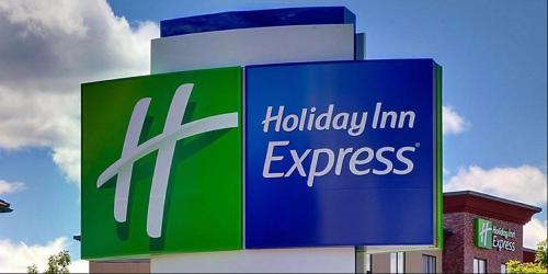 a sign for a holiday inn express on a building at Holiday Inn Express & Suites - Carlisle Southwest I-81 by IHG in Carlisle