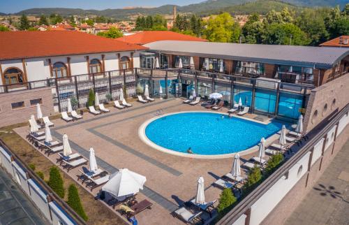 an aerial view of a hotel with a swimming pool at Kamengrad Hotel & SPA in Panagyurishte