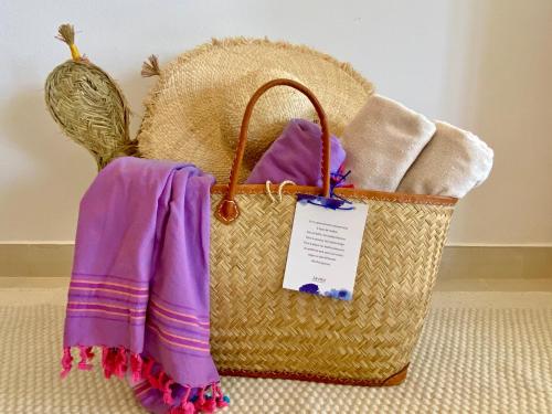 a basket with towels and a tag on it at Jávea Apartment Mar in Jávea
