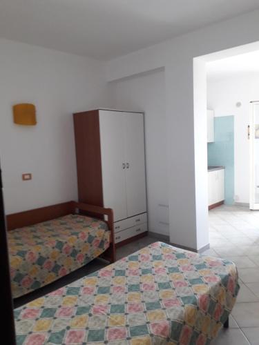 Katil atau katil-katil dalam bilik di Villa dei pini