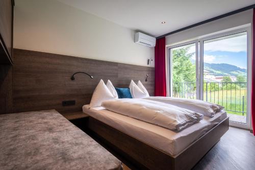 Freiraum 9 Living Apartment tesisinde bir odada yatak veya yataklar