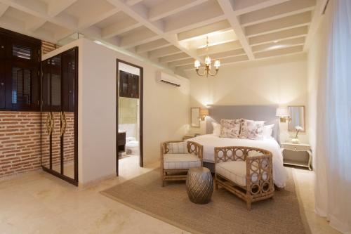 Un pat sau paturi într-o cameră la Hotel Capellán de Getsemaní