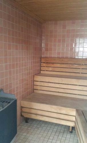 a sauna with wooden steps and a trash can at Grandblue condominium Room 606 in Mae Pim