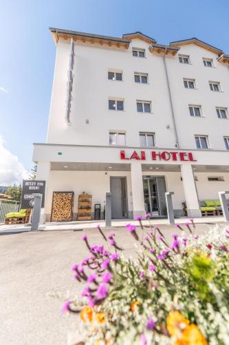 a hotel with flowers in front of it at Lai Lifestyle Hotel in Lenzerheide