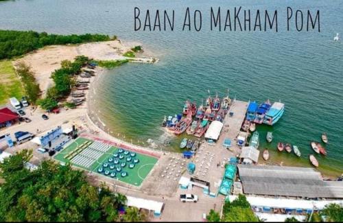a group of boats are docked at a marina at Grandblue condominium Room 606 in Mae Pim