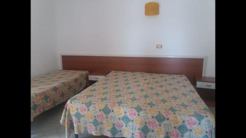 Katil atau katil-katil dalam bilik di Villa dei pini