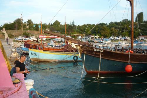 two boats are docked in the water at a harbor at Hris in Chernomorets