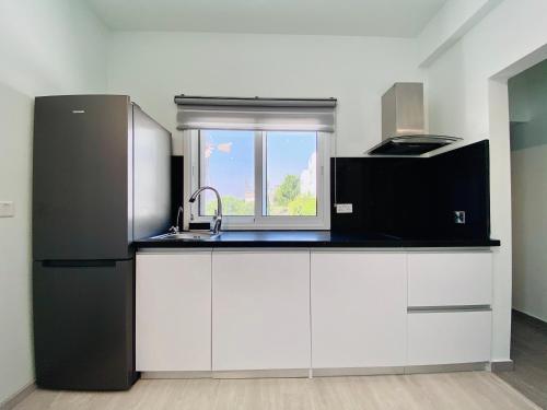 Kuhinja ili čajna kuhinja u objektu SANDY BAY Villa