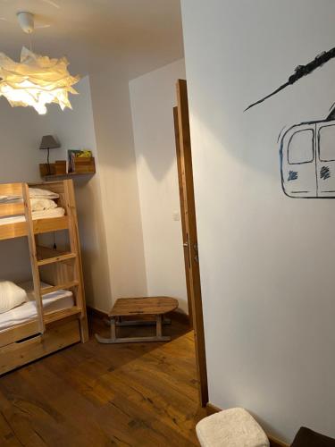 a room with a door leading to a room with a shelf at Chalet Le Triollet in Saint-Gervais-les-Bains