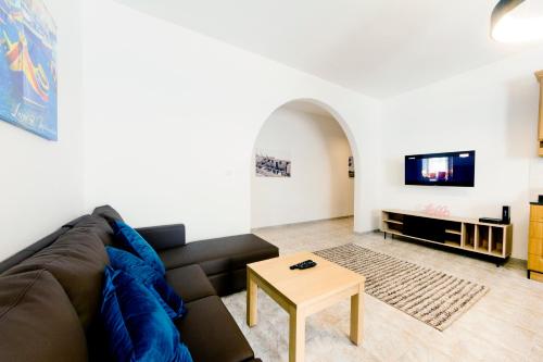 a living room with a couch and a table at Central 3 Bedroom Entire Apartment Msida in Msida