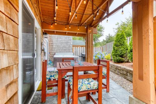 a patio with a table and chairs and a grill at Lake & Ocean in Rockaway Beach