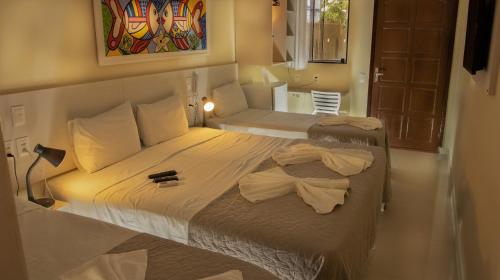 Katil atau katil-katil dalam bilik di Pousada Elo Inn