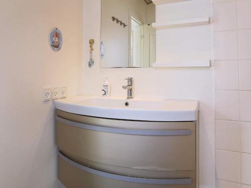 a bathroom with a sink and a mirror at 6 person holiday home in Slagelse in Slagelse