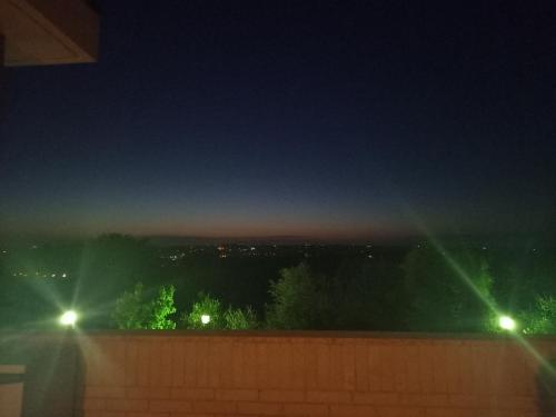 a view of a city at night with lights at La Principessa Nera B&B in Ostra