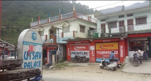 a group of buildings with motorcycles parked in front at Hotel SHREE Uttarkashi in Uttarkāshi