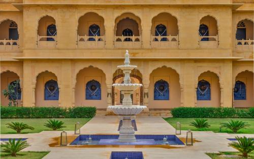 a fountain in front of a building at Hotel Jaisalkot in Jaisalmer