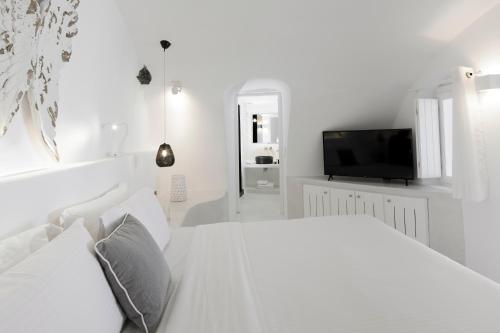 Ένα ή περισσότερα κρεβάτια σε δωμάτιο στο Dana Villas & Infinity Suites