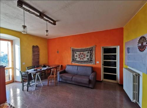 a living room with a couch and a table at Umbria In Bike B&B in Foligno