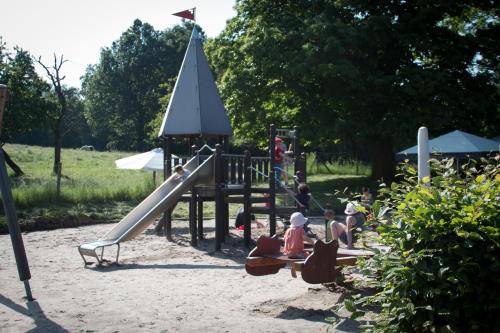 a group of children playing on a playground at Hotel Bremerhof in Kaiserslautern