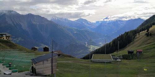 a view of a valley with mountains in the background at Chalet Valaisia in Riederalp