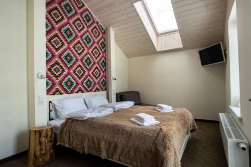 Postel nebo postele na pokoji v ubytování Шале БІЛИЙ ЛЕВ - WHITE LION Chalet