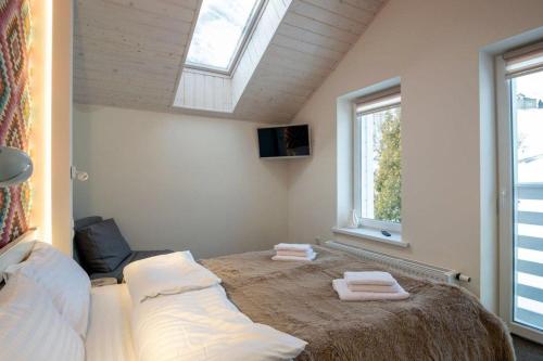 Postel nebo postele na pokoji v ubytování Шале БІЛИЙ ЛЕВ - WHITE LION Chalet