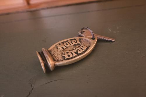 a metal key on top of a table at Das Bräu ORIGINAL in Lofer