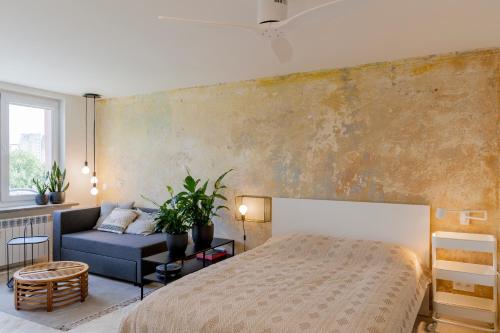 Posteľ alebo postele v izbe v ubytovaní Uni Apartament
