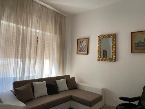 a living room with a couch and a window at Golden House in Palmi