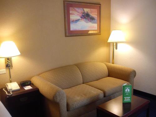a living room with a couch in a hotel room at Wyndham Garden Monterrey Norte in Monterrey