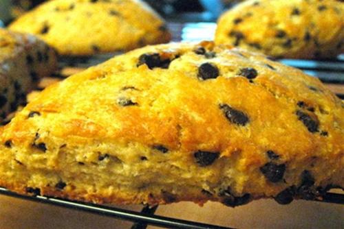 a muffin with chocolate chips sitting on a cooling rack at Harbour Towne Inn on the Waterfront in Boothbay Harbor